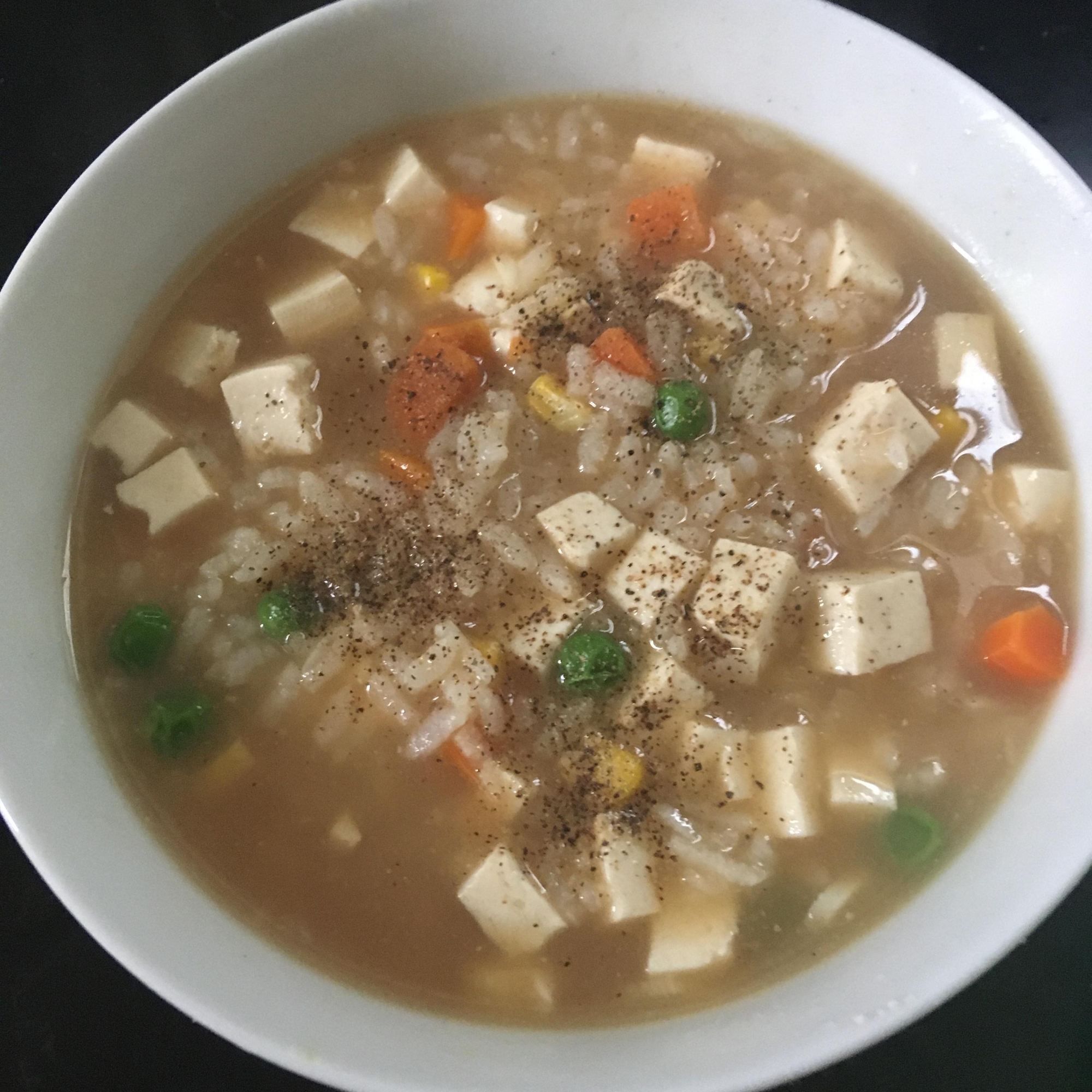 豆腐、にんにく、ミックスベジタブルの雑炊