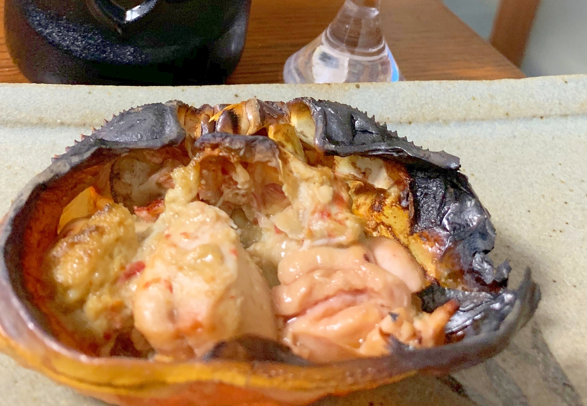 お酒がすすむ、鮭の白子と蟹味噌の甲羅焼き