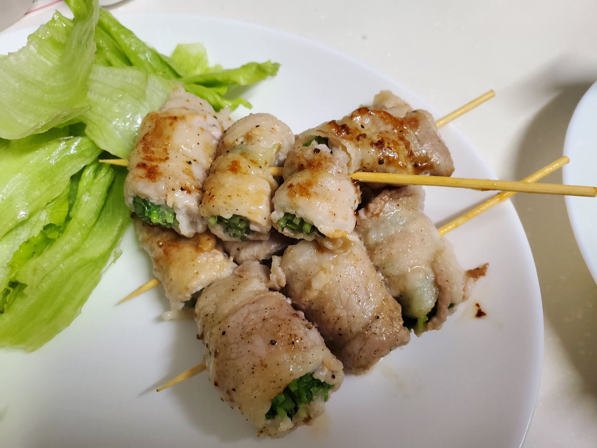 豆苗と大場の豚ばら巻き
