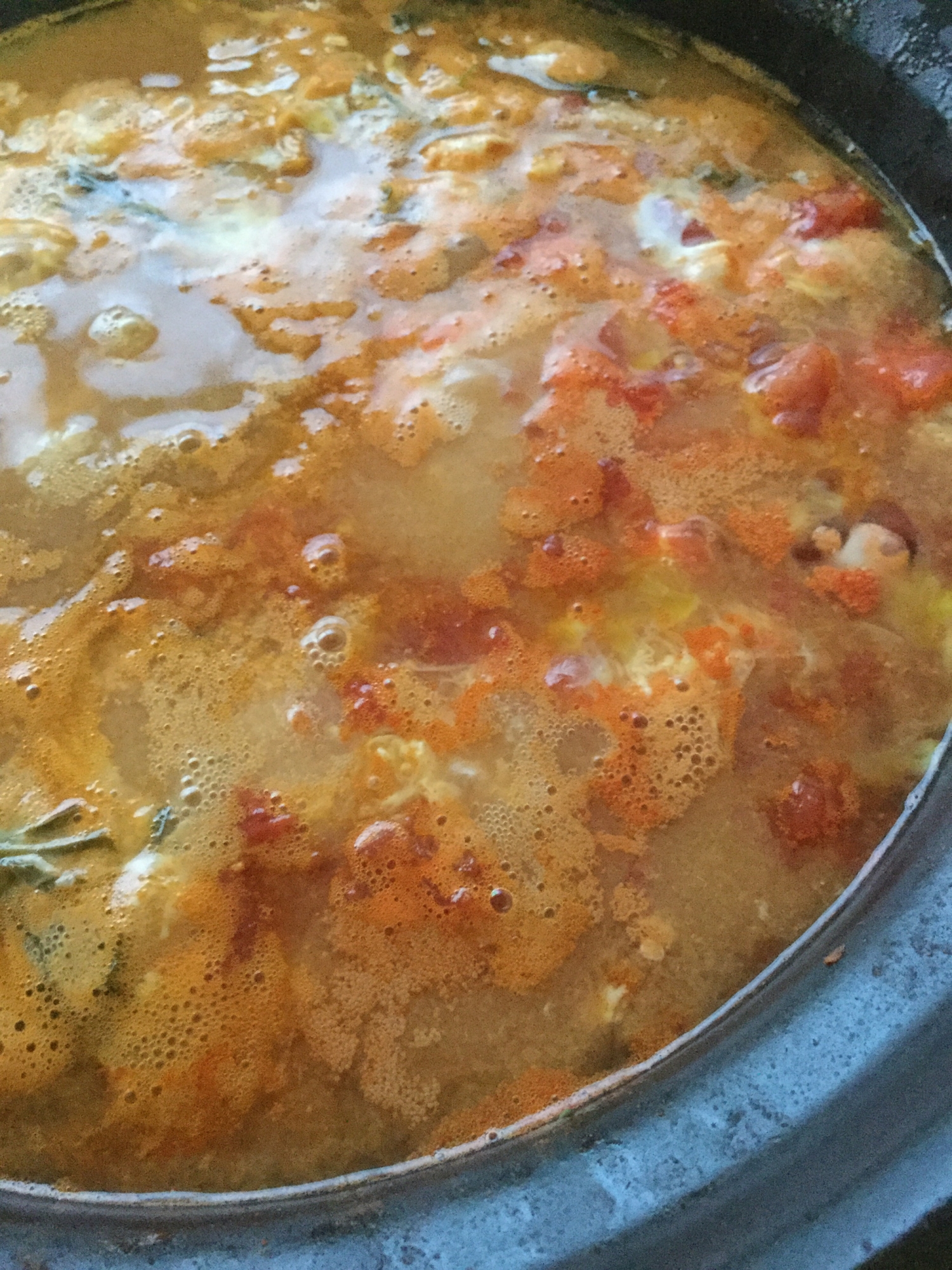 キムチ鍋の残りでトマト雑炊